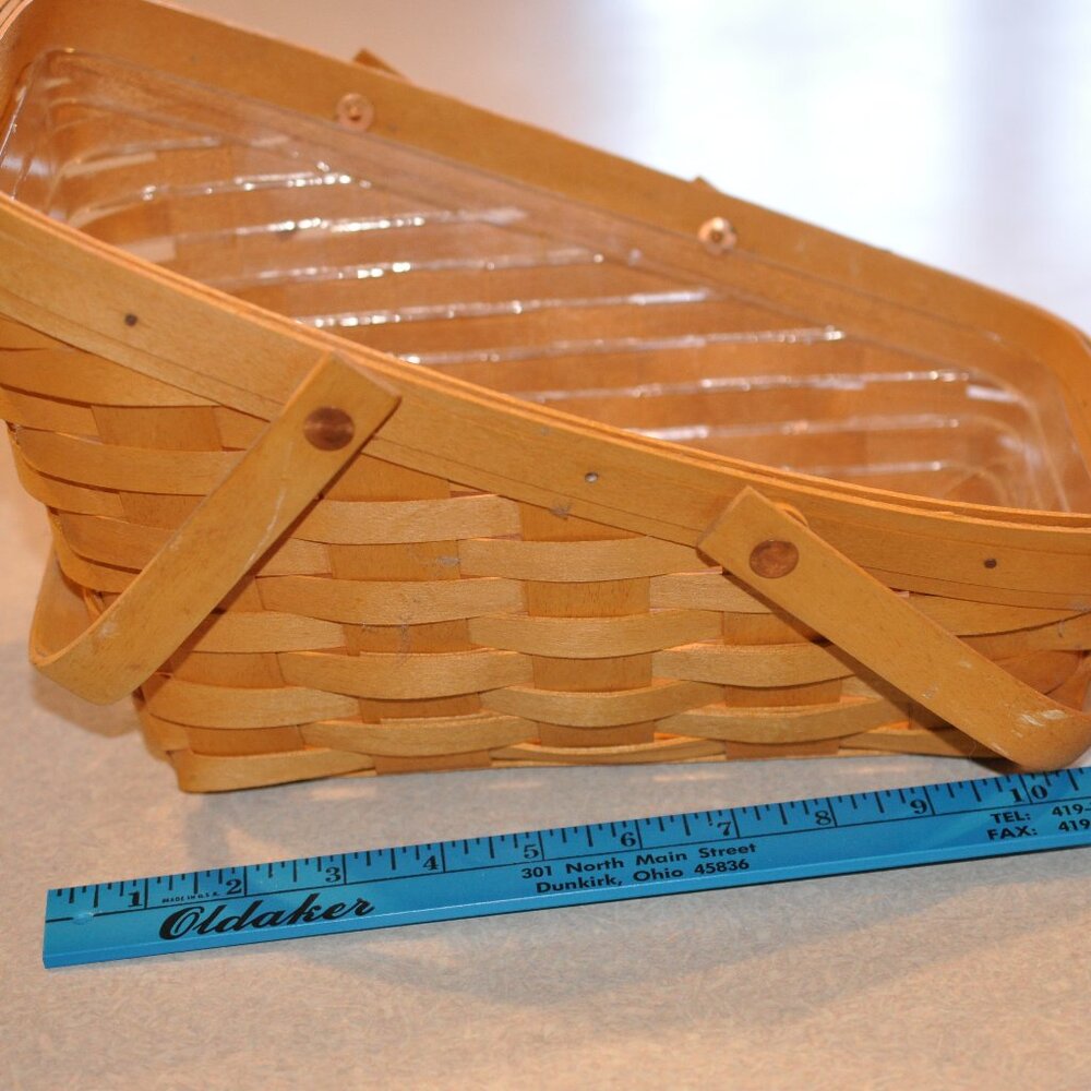 Longaberger Angled basket with swing handles, and plastic protector.